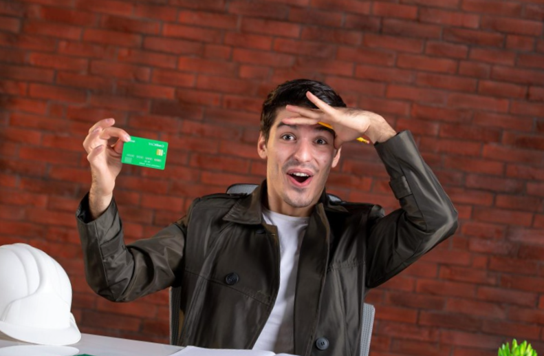 man showing his business credit card amazed