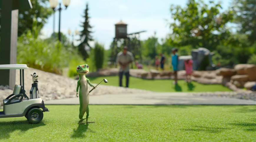 geico gecko playing golf