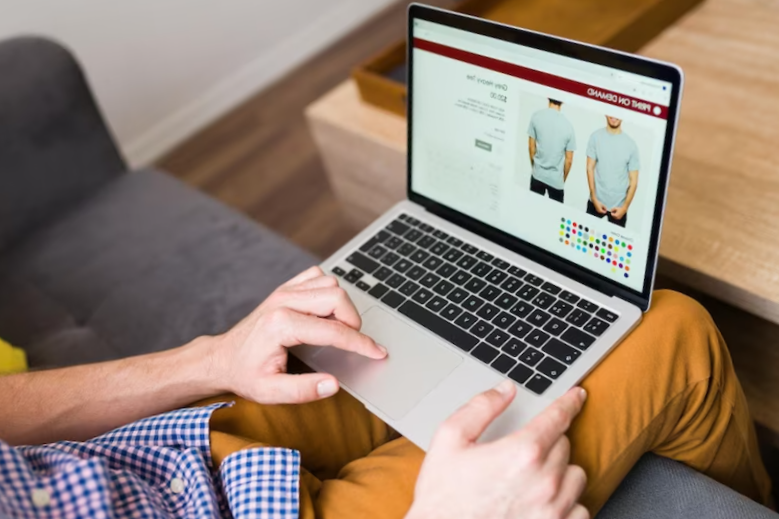 adult man doing online shopping during a leisure day at home. young man buying clothes online
