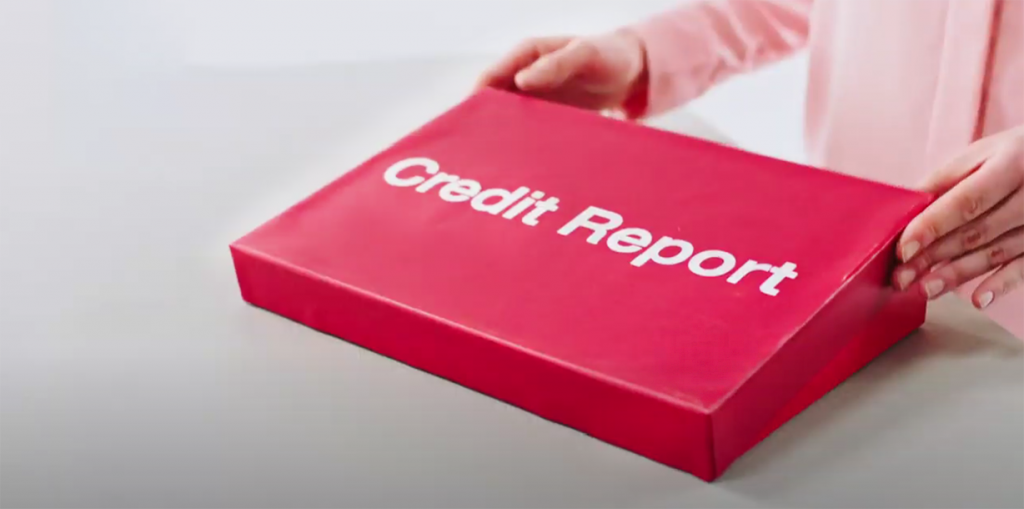 hands opening a red box with phrase: credit report 